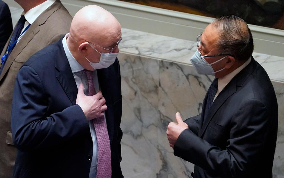 Vassily Nebenzia, left, Russia's UN Ambassador and current president of the UN Security Council, confers with Zhang Jun, left, China's UN Ambassador, prior to the Security Council meeting on the Russian invasion of Ukraine.