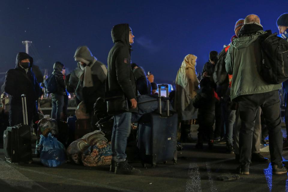 Refugees arrive at the Medyka border crossing after fleeing from the Ukraine, in Poland, on Feb. 28, 2022.