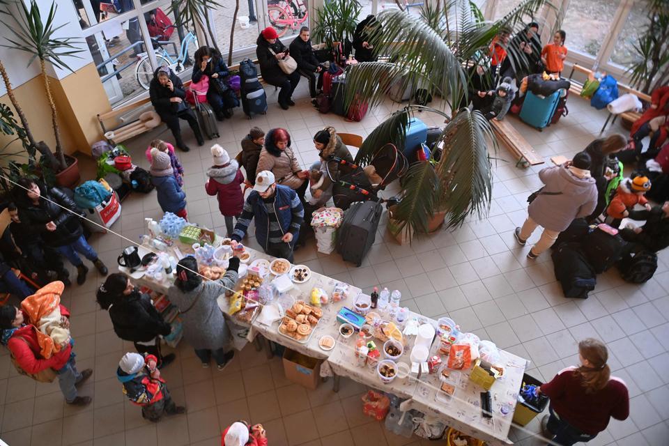 Volunteers serve food and drinks to Ukrainian refugees at the temporary refugee centre in a local primary school at Tiszabecs, eastern Hungary on Feb. 28, 2022.