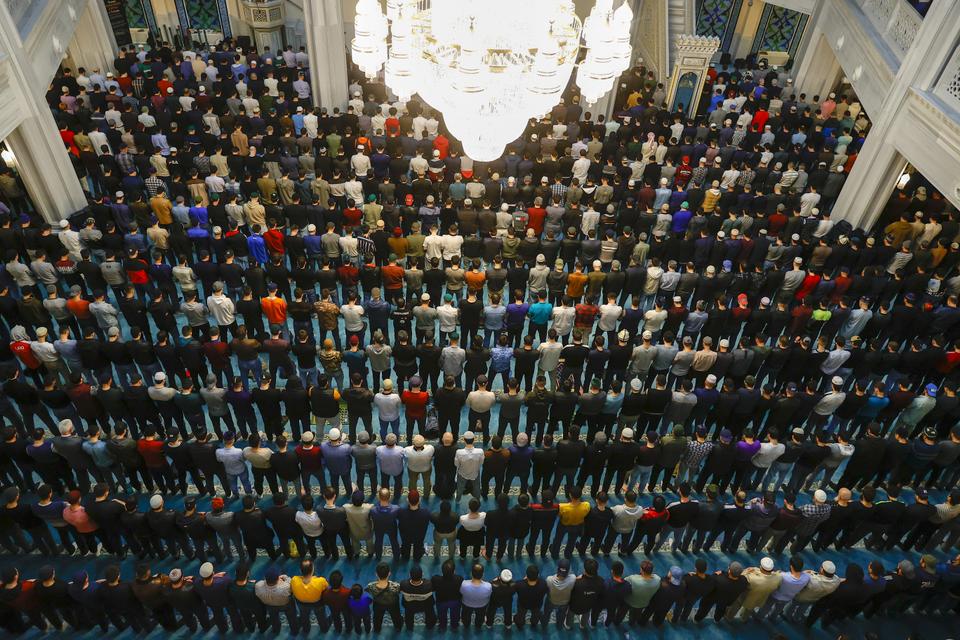 Muslims pray at the Central Mosque to mark Laylat al Qadr in Moscow, Russia.