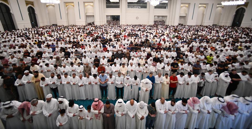 Muslims stand inside the Al-Ghanim and Al-Kharafi Mosques in prayer during Laylat al Qadr in Kuwait City, Kuwait.