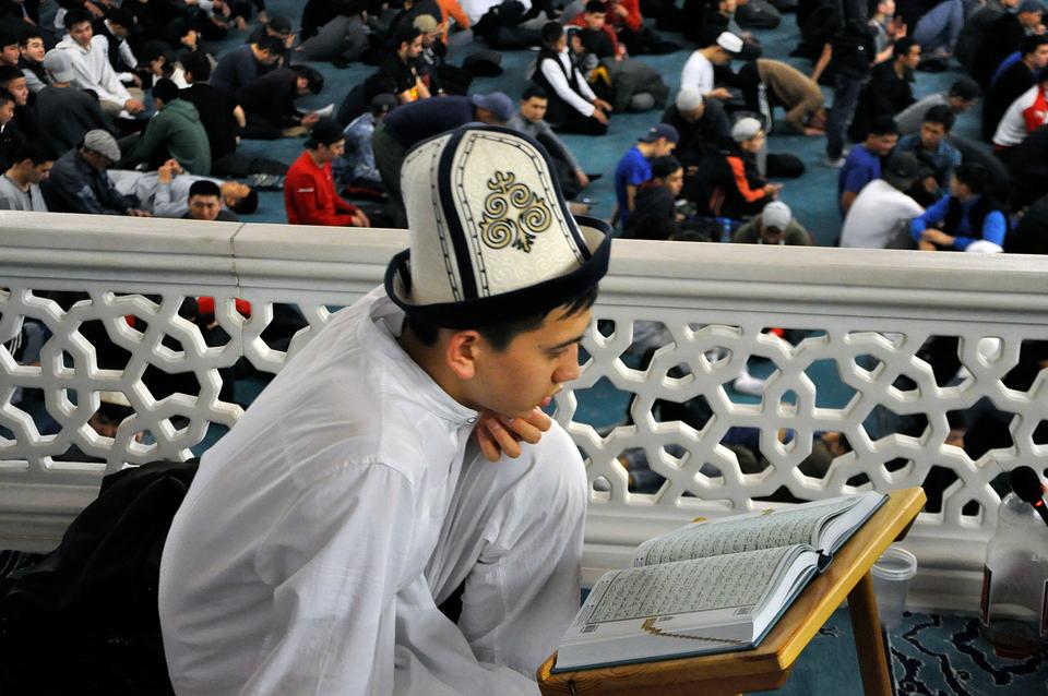 A boy reads the Holy Quran at the Abdulkarim Satuq Bughra Khan Mosque during Laylat al Qadr in Bishkek, Kyrgyzstan.