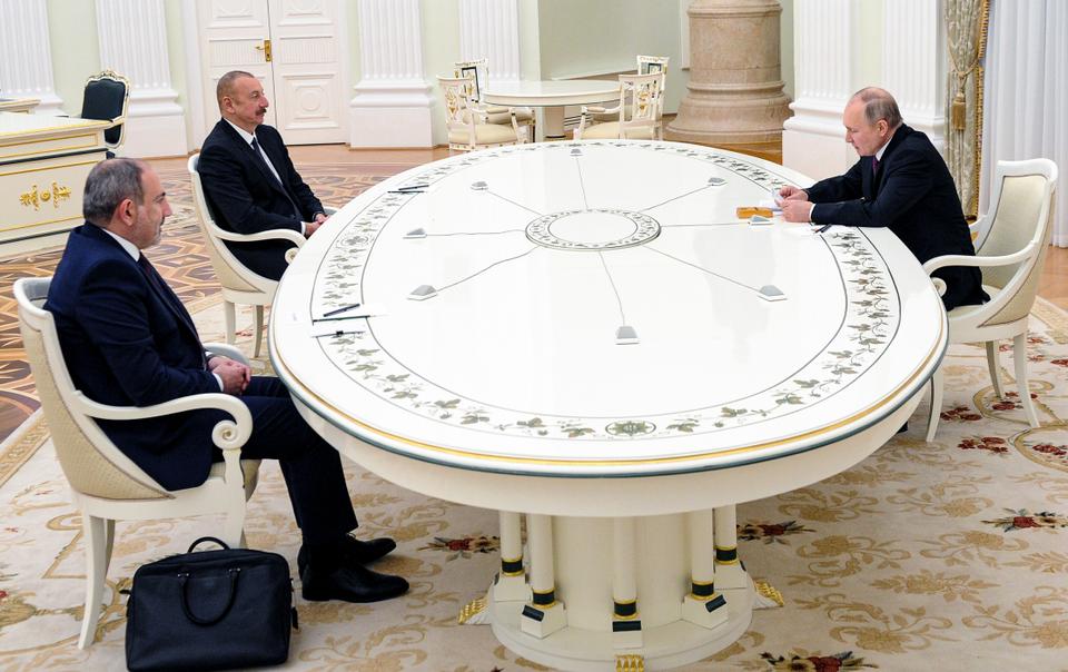 Russian President Vladimir Putin attends talks with Azerbaijan's President Ilham Aliyev, second left, and Armenian Prime Minister Nikol Pashinyan at the Kremlin in Moscow.