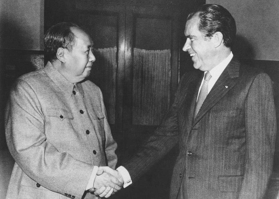 Then-Chinese communist party leader Mao Zedong, left, and then-US President Richard Nixon shake hands as they meet in Beijing on Feb. 21, 1972.