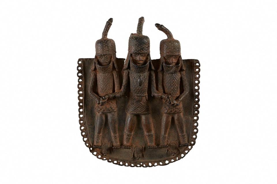 A square bronze pendant or ornament, one of the objects that London's Horniman Museum says was looted from Benin City by British soldiers in 1897 and will be returned to Nigeria's government, is pictured in this undated handout image.