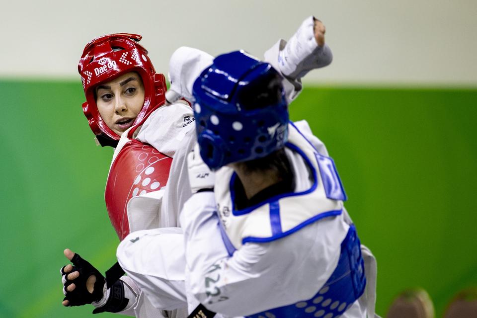 Turkish athlete Zeliha Agris (right) competes in taekwondo with Morocco's El Bukhti Umaima (left).  — Anatolian Agency