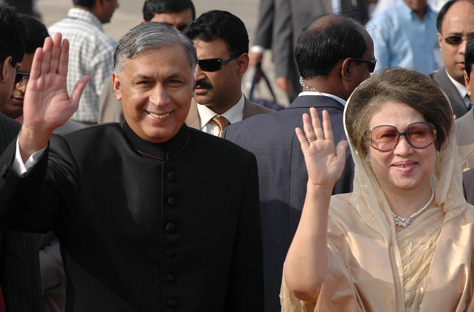 Pakistani Prime Minister Shaukat Aziz, left, and his Bangladesh counterpart Khaleda Zia wave to photographers at the Zia International airport in Dhaka, Bangladesh, Wednesday, November 3, 2004.