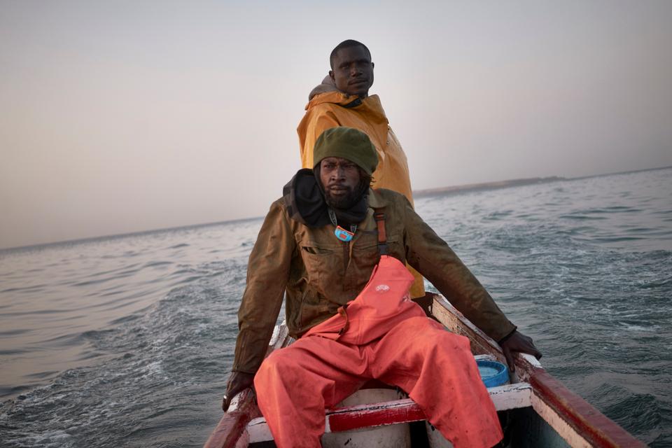 Madj and Bouba return to port after a good night of fishing.