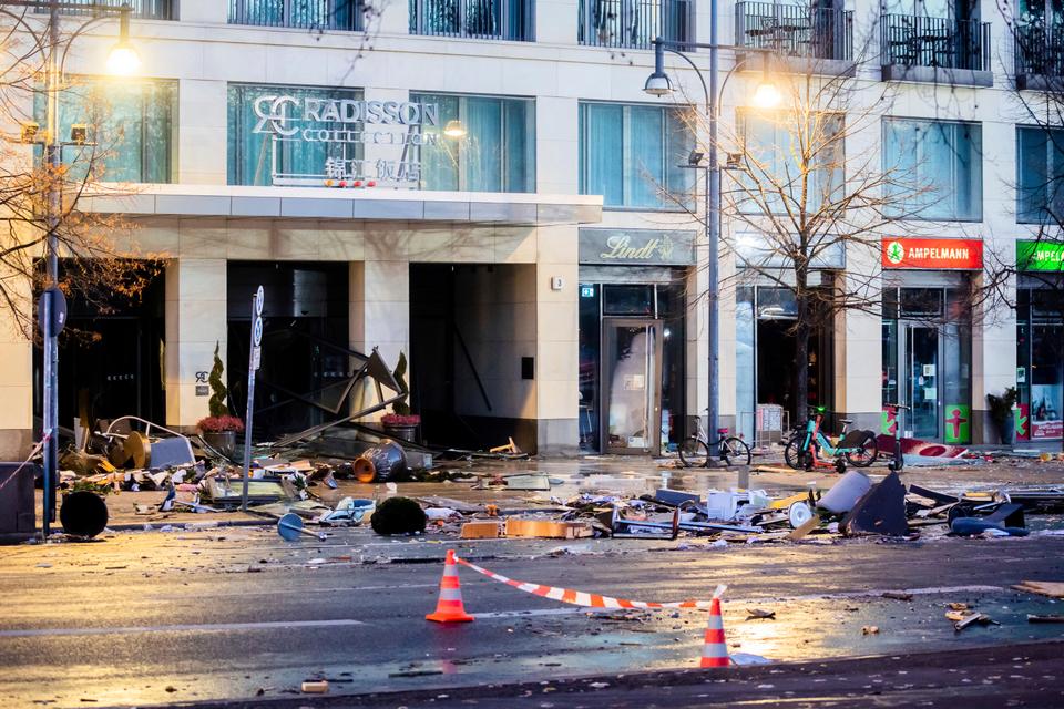 Glass and other debris were swept out of the building, which also contains a hotel and cafes, as 1 million litres of water poured out of the 25-metre-high aquarium.