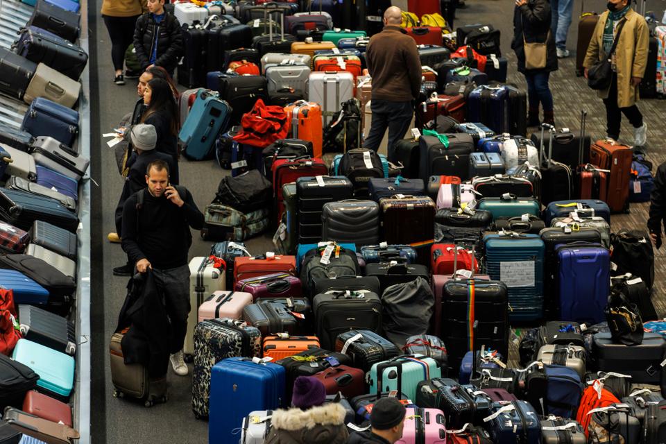 Luggage is amassed in the baggage claim area at Toronto Pearson International Airport.