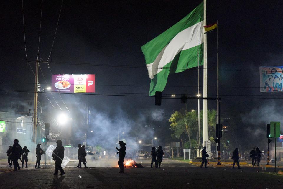 Police officers patrol as supporters of Luis Fernando Camacho, the governor of Santa Cruz and a prominent opposition leader, hold a protest following Camacho's detention by the Bolivian police, in Santa Cruz de la Sierra.