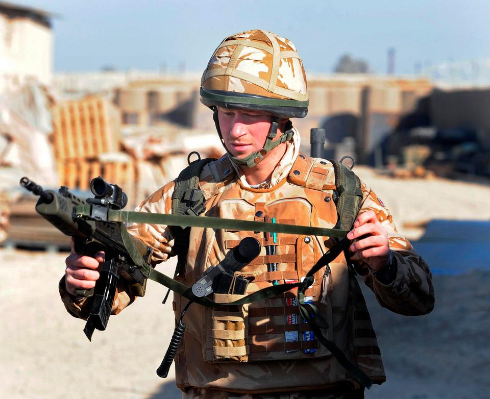 Prince Harry holds his SA80 rifle as he prepares to patrol through the deserted town of Garmisir close to FOB Delhi (forward operating base), in Helmand province, southern Afghanistan on January 2, 2008.