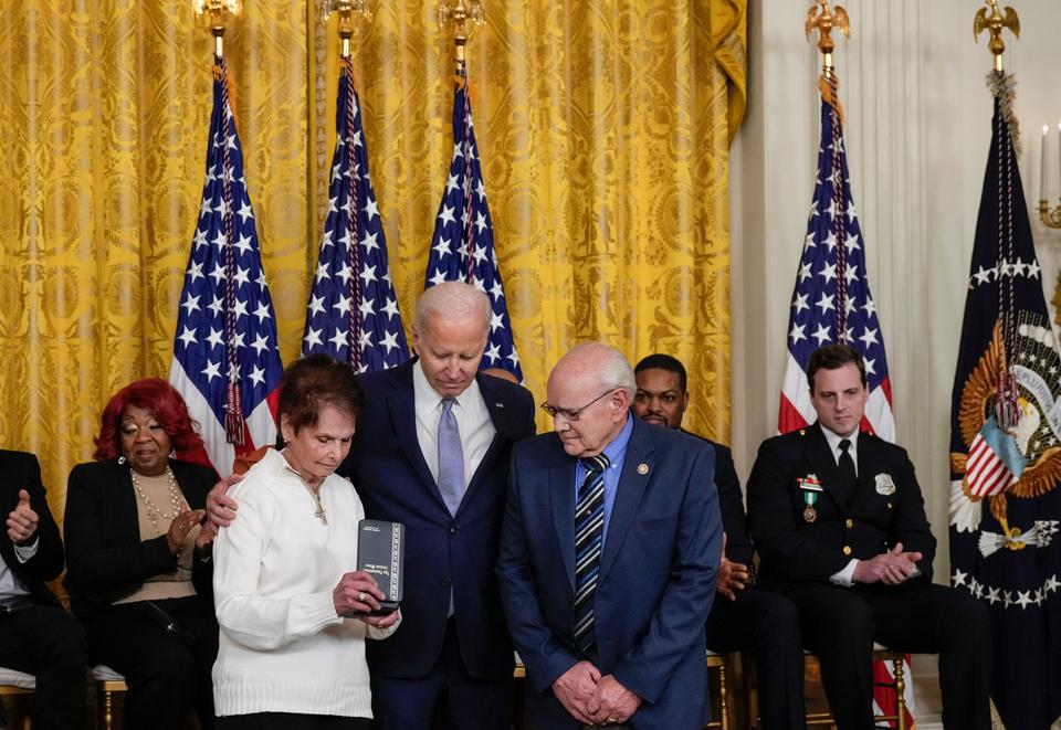 Biden gives the award to Capitol Police officer Brian Sicknick's parents.