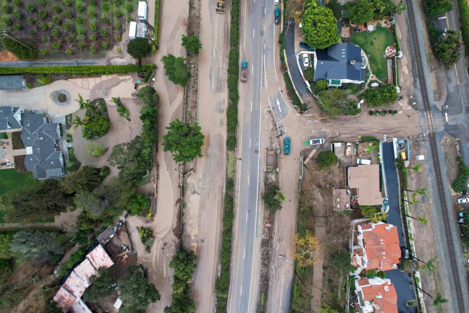 In an aerial view, a flooded area by the overflowing San Ysidro creek on Jameson Lane is seen near the closed Highway 101 in Montecito, California.