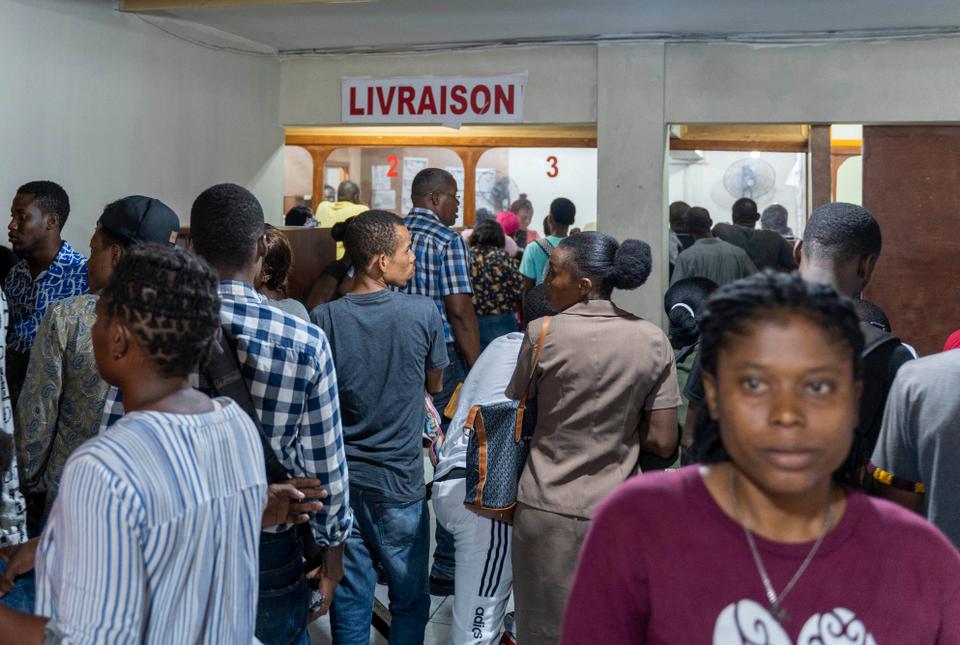 In the halls of the migration office in the Haitian capital, people seeking a way out line up and wait their turn.