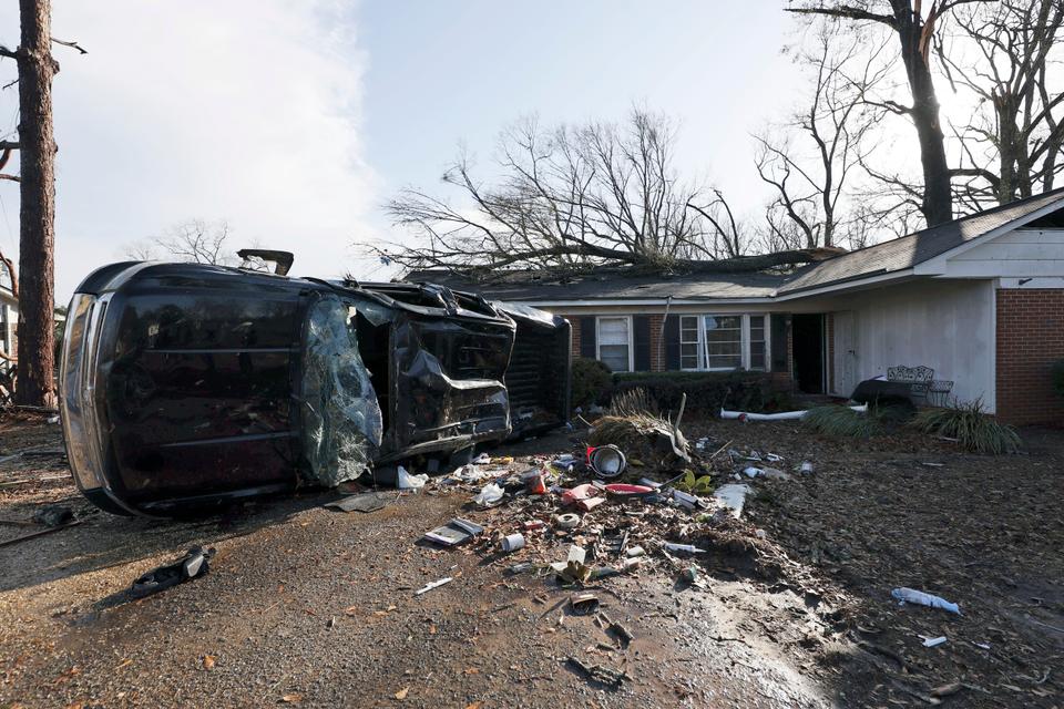 A vehicle is upended and debris is strewn about follow a tornado near Meadowview elementary school.