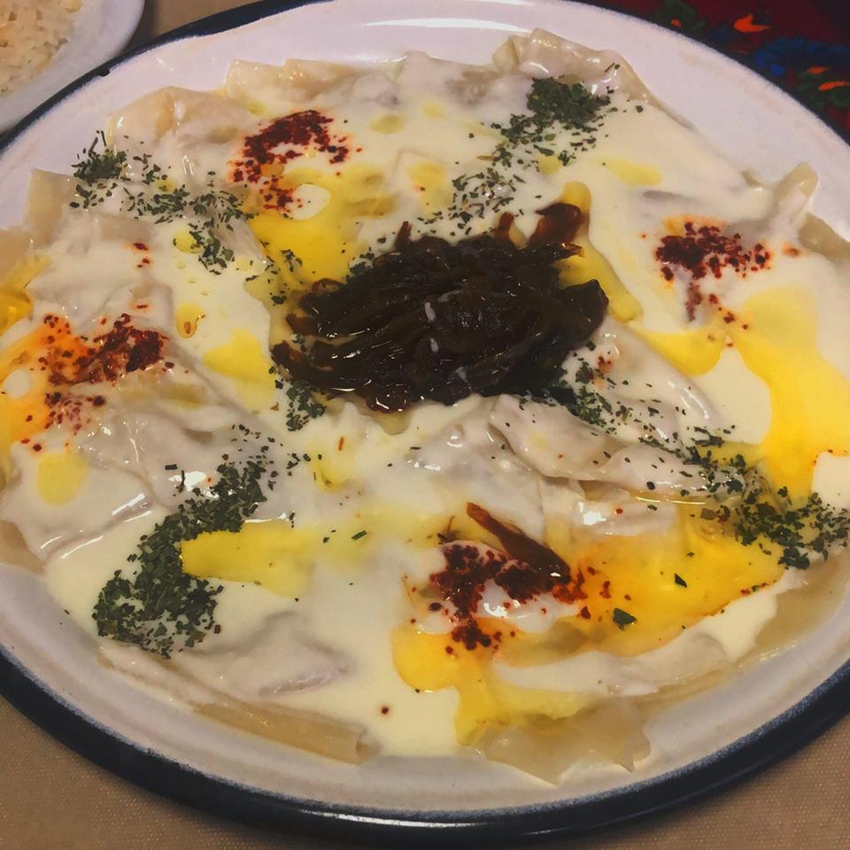 Hangel is a traditional dish topped with a sauce consisting of yoghurt with garlic, caramelised onions, red pepper and dry mint.