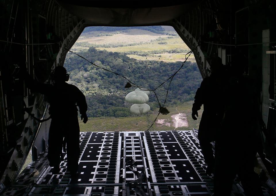 Food is airdropped from a military transport aircraft to the Surucucu military base, to be delivered to Yanomami indigenous people, in Alto Vista, Roraima state, Brazil, Jan 26, 2023.