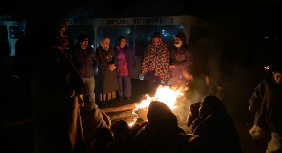 Earthquake survivors are trying to stay warm in the streets in Gaziantep after powerful quakes hit Türkiye's southeastern provinces. Photo from TRT World’s Ezgi Toper, who is currently in Gaziantep at the site of a collapsed building.