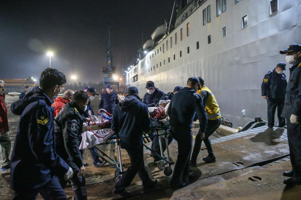 One of the victims of Monday's earthquake taken by rescuers on board TCG Iskenderun early on Tuesday.