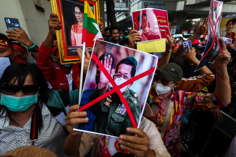 Protesters hold up a picture of Myanmar's coup leader Min Aung Hlaing during a demonstration to mark the second anniversary of Myanmar's 2021 military takeover.