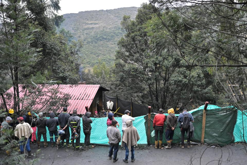 Miners and relatives wait for news after an explosion at a coal mine in Sutatausa municipality.