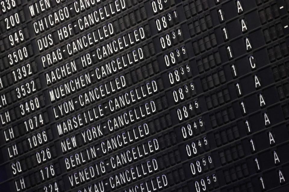 A display board shows the list of cancelled flights at Frankfurt airport on March 27, 2023.