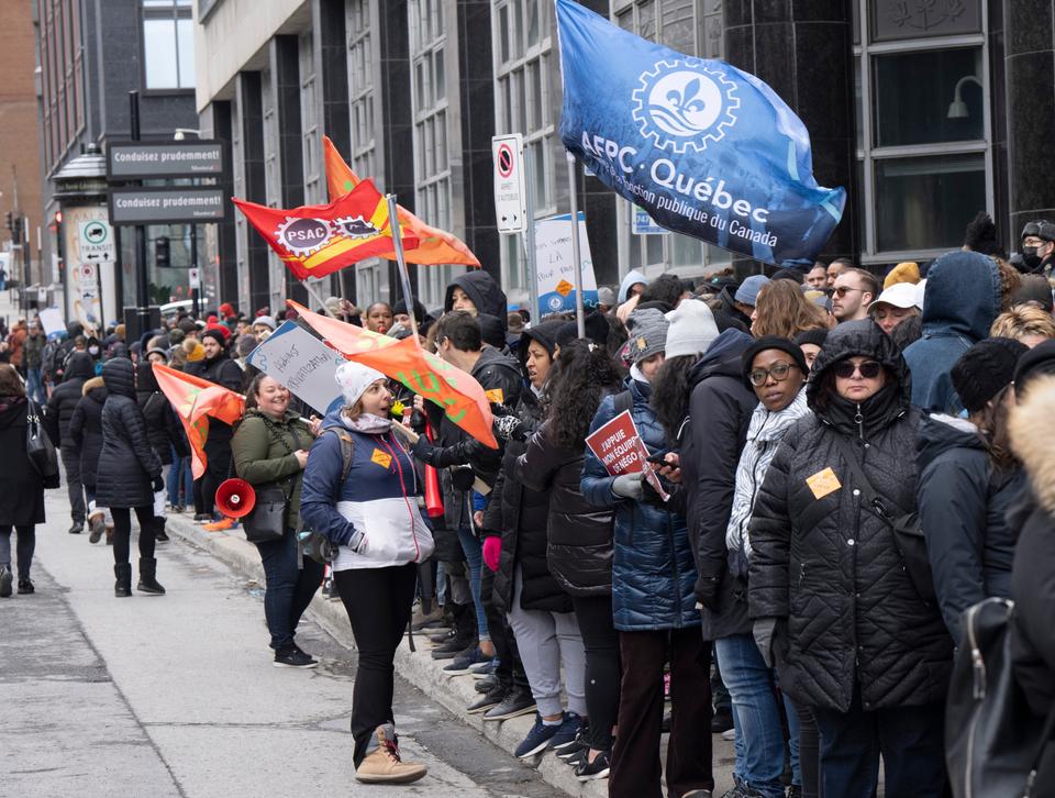 Canada Revenue Agency workers form a picket line while close to 50,000 workers remain at work as they are deemed essential.