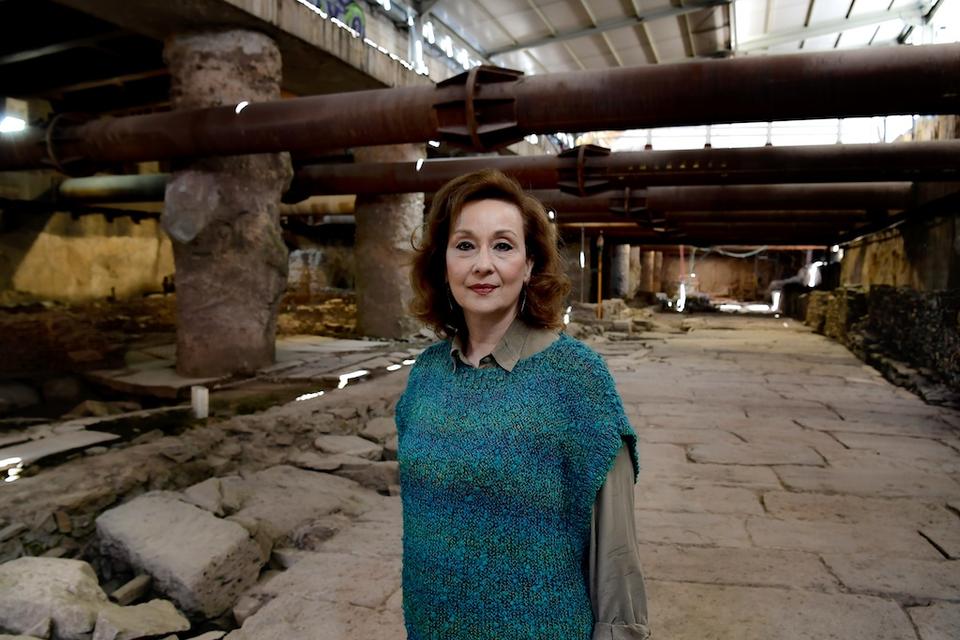 Polyxene Adam-Veleni, head of the Thessaloniki antiquities ephorate, poses in front of the remains of a crossroads of the Decumanus Maximus, an ancient site under the city centre of modern Thessaloniki, on April 25, 2018