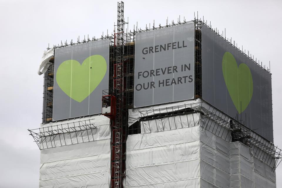 New hoarding covers the top of Grenfell Tower to mark the first anniversary of the fire that killed 72 people at the social housing tower block in west London. June 8, 2018.