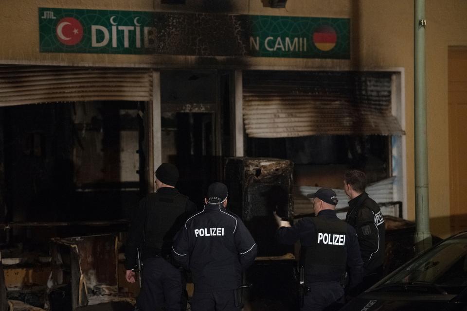 In this March 11, 2018 file photo, police stand in front of a mosque that was attacked overnight in Berlin, Germany.