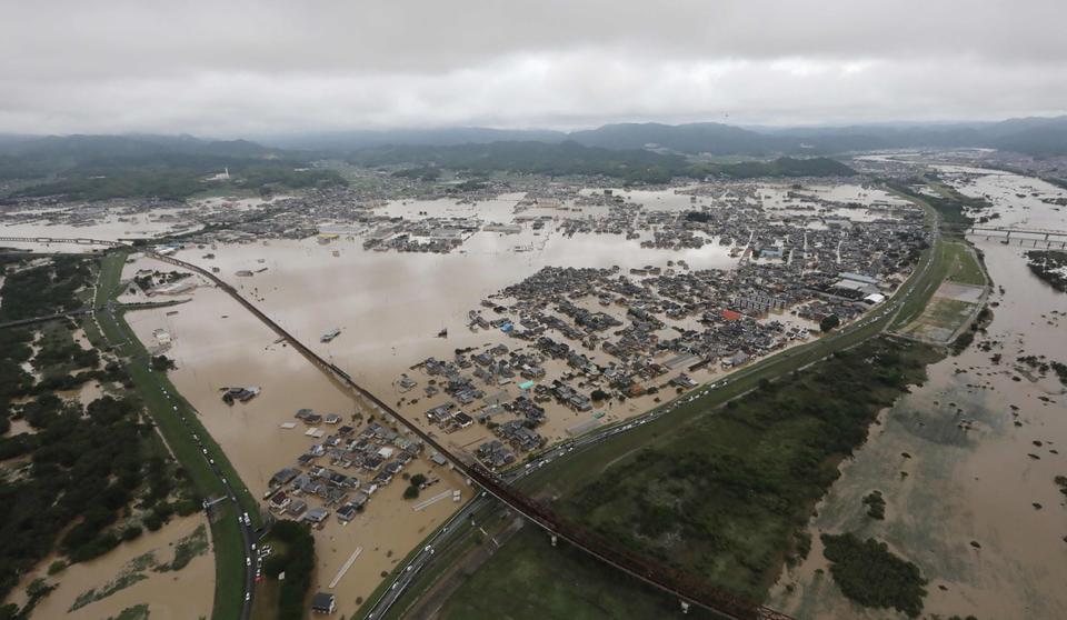 This picture shows an aerial view of flooded houses in Kurashiki, Okayama prefecture on July 8, 2018.