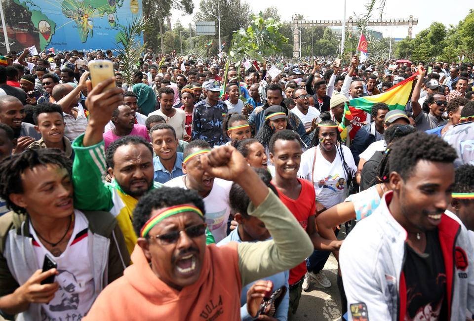 People celebrate during the welcoming ceremony of Eritrea's President Isaias Afwerki, at the Bole international airport.