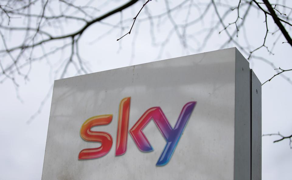 In this file photo taken on March 17, 2017 a Sky logo is pictured on a sign next to the entrance to pay-TV giant Sky Plc's headquarters in Isleworth, west London.