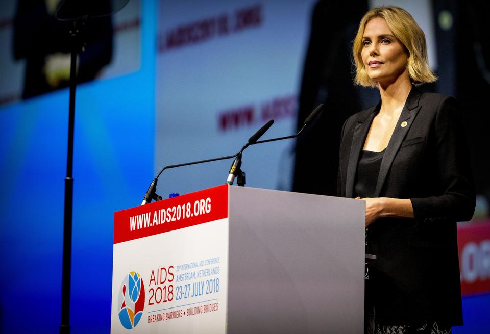 Charlize Theron speaks in Amsterdam, on July 24, 2018, on the second day of the AIDS2018 congress aimed at launching a new coalition of global AIDS funders.