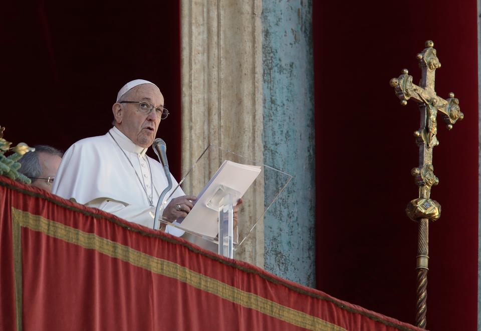 Pope Francis delivers his message during the Urbi et Orbi (Latin for 'to the city and to the world' ) Christmas' day blessing from the main balcony of St. Peter's Basilica at the Vatican.