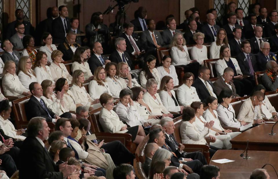 Female lawmakers dressed in white watch as President Donald Trump delivers the State of the Union address in the chamber of the US House of Representatives at the US Capitol Building on February 5, 2019 in Washington, DC.