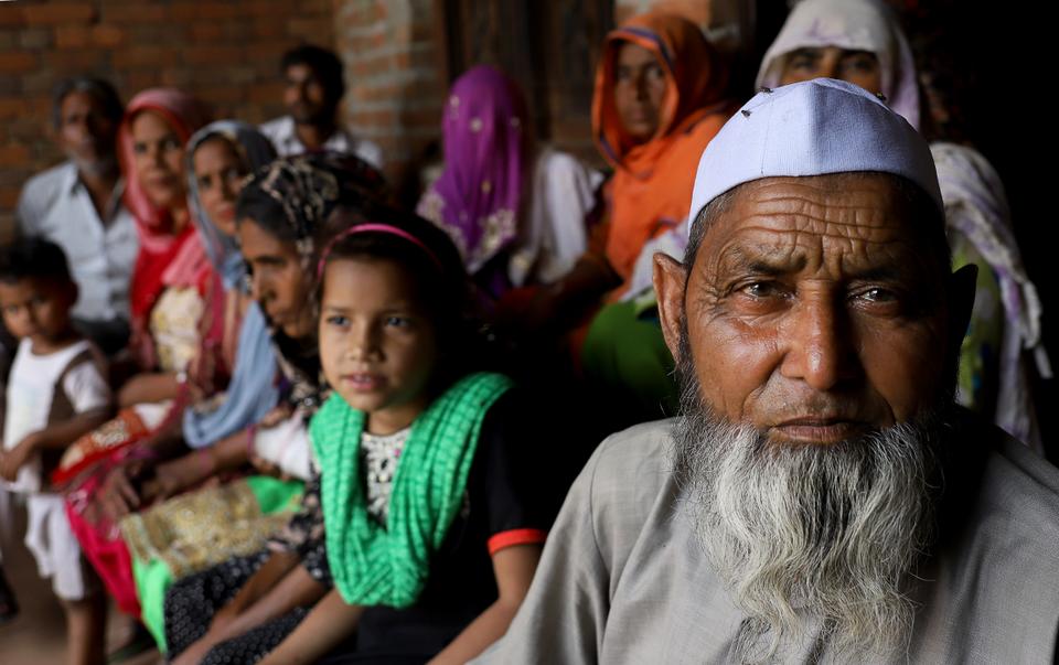 Umar-ud-Din, 77, poses with other Muslim victims of Muzaffarnaar riots, during the first phase of seven-staged Indian election. He says, 