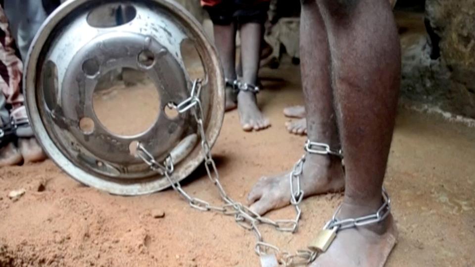 People with chained legs are pictured after being rescued from a building in the northern city of Kaduna, Nigeria September 26, 2019, in this grab obtained from a video