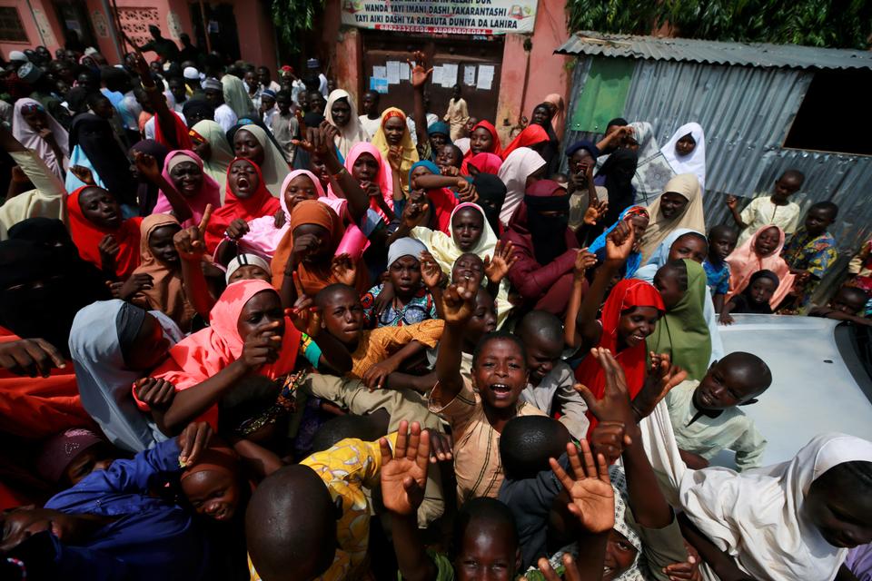 People protest outside the building where hundreds of men and boys were rescued from captivity by police in Kaduna, Nigeria September 28, 2019.