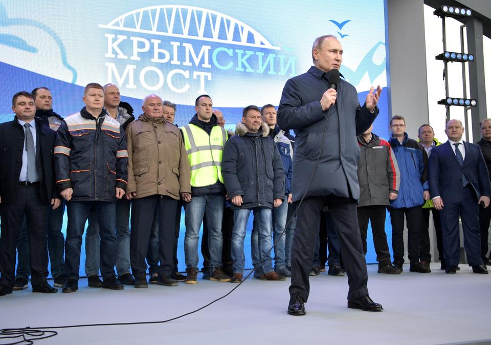 Russian President Vladimir Putin delivers a speech during the opening ceremony of the railway part of a bridge, which was constructed to connect the Russian mainland with the Crimean Peninsula across the Kerch Strait, in Taman, Russia December 23, 2019.