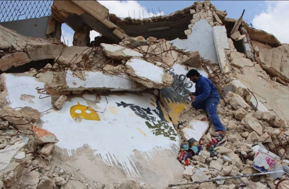 Syrian graffiti artist Aziz al Asmar turns damaged houses and buildings into artspaces.