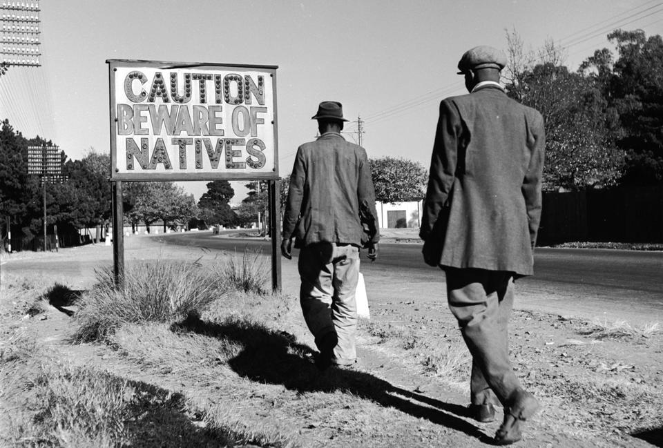 A sign common in Johannesburg, South Africa, reading 'Caution Beware Of Natives'.