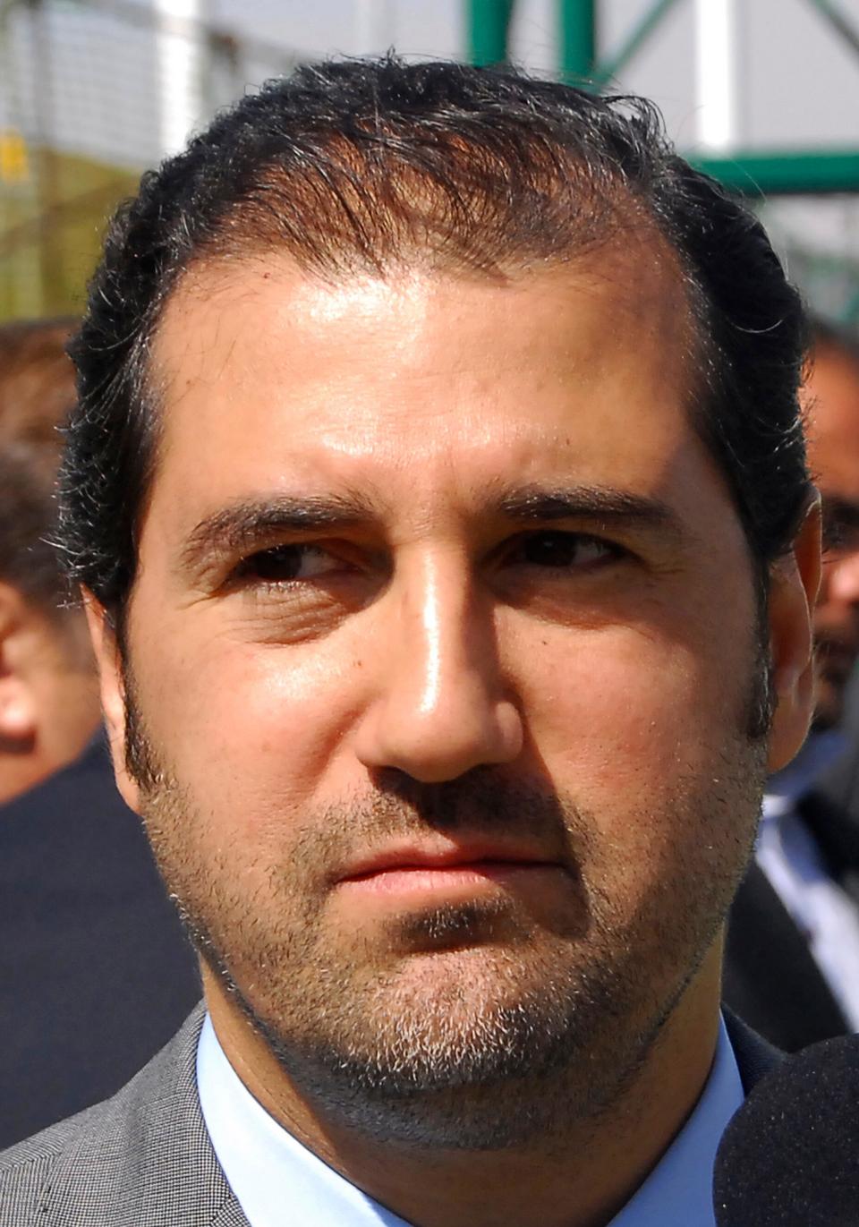 In this April 24, 2010 file photo, Rami Makhlouf, a cousin of Syrian President Bashar Assad and one of that country’s wealthiest businessmen, attends an event to inaugurate a hotel project, in Damascus, Syria.