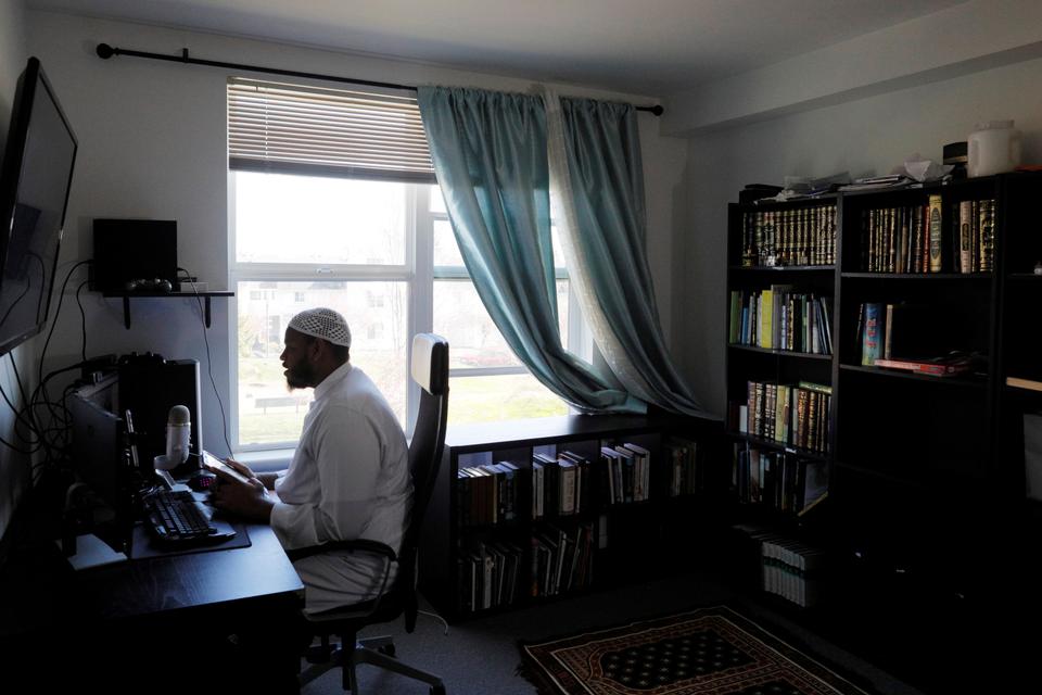 Sheikh Fuad Mohamed, Imam at the Muslim American Society of White Center, livestreams his Friday Sermon from his home, amid restrictions against group gatherings because of the coronavirus disease (COVID-19) outbreak, in Seattle, Washington, U.S., March 20, 2020.