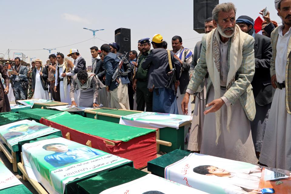 Mourners attend the funeral of people, mainly children, killed in a Saudi-led coalition air strike on a bus in northern Yemen, in Saada, Yemen August 13, 2018.