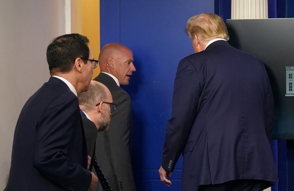US President Donald Trump leaves a coronavirus pandemic briefing at the White House in Washington, US, August 10, 2020.