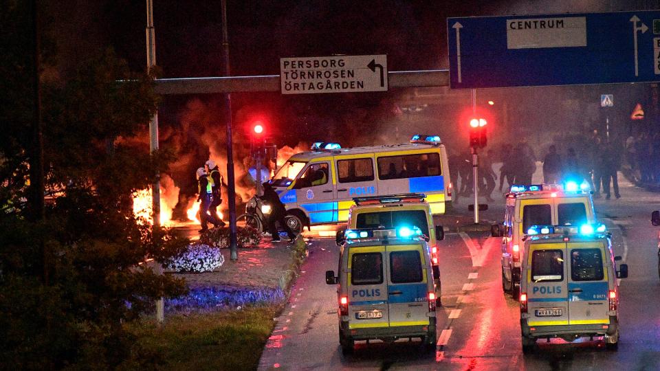 Smoke billows from the burning tyres, pallets and fireworks during a riot in the Rosengard neighbourhood of Malmo, Sweden August 28, 2020.