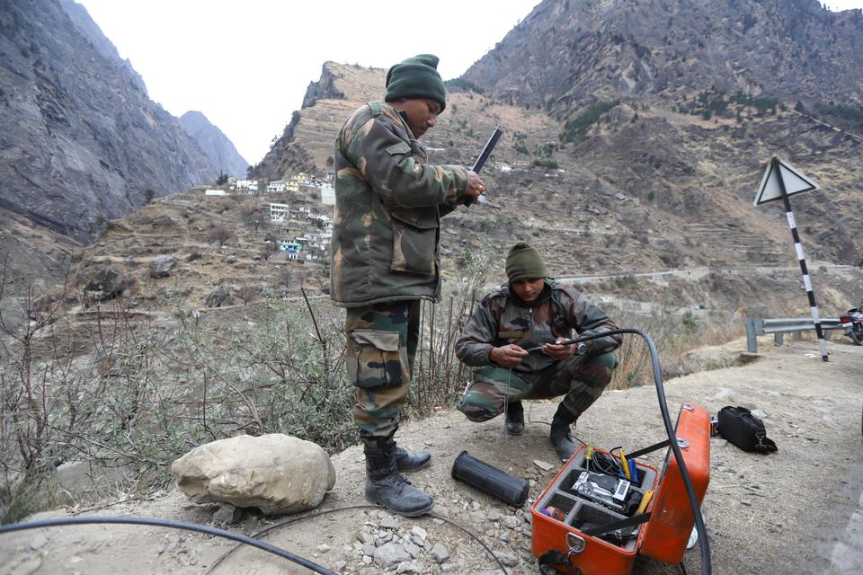 Indian Army soldiers repairing the telephone cables to restore connectivity in the Niti Valley of Chamoli District in Uttarakhand.