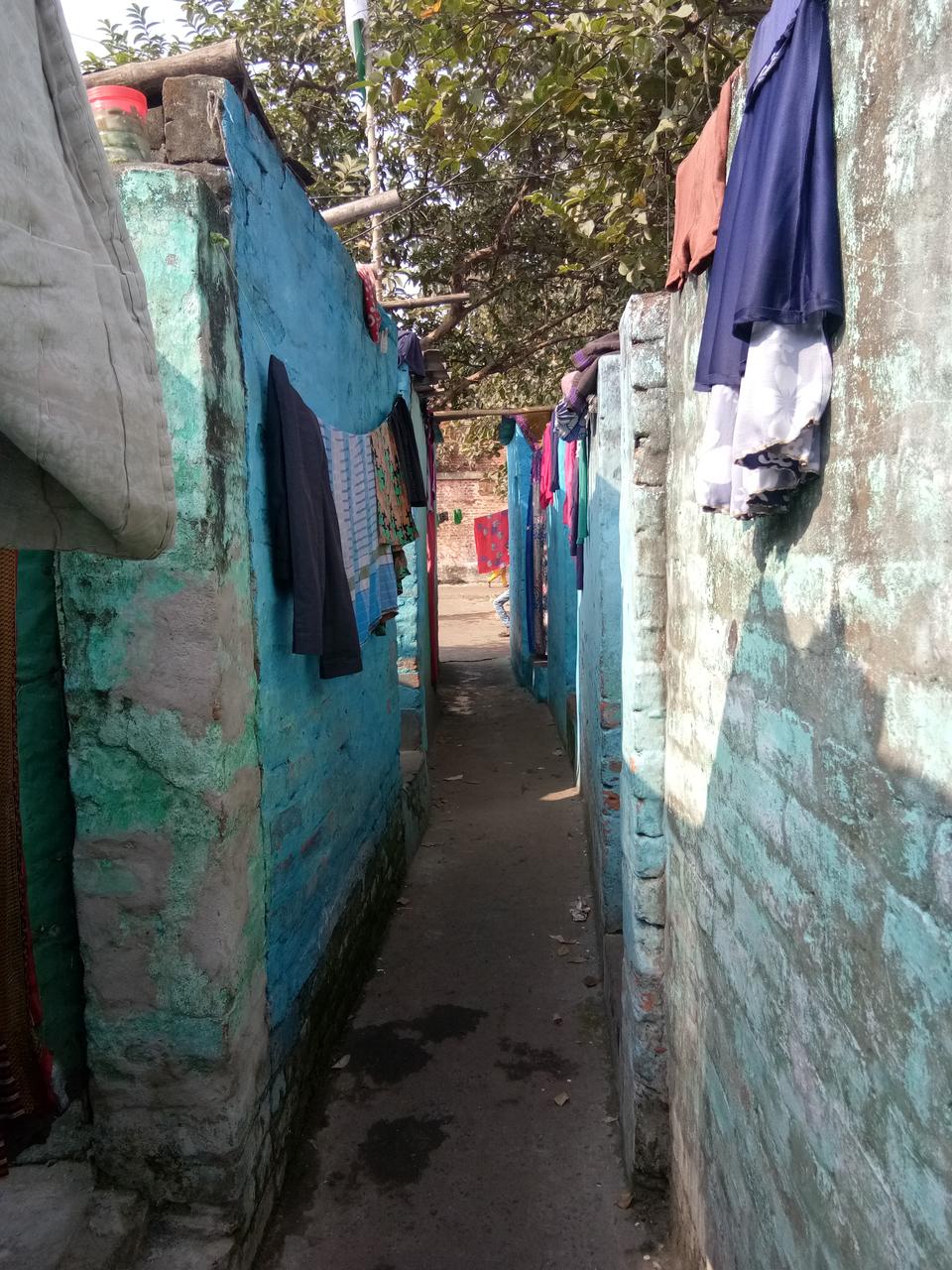 The lanes in workers quarters are as narrow as this one, housing both Hindus and Muslims.